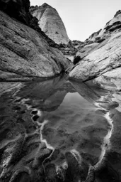 Reflection of Stone on Sand
